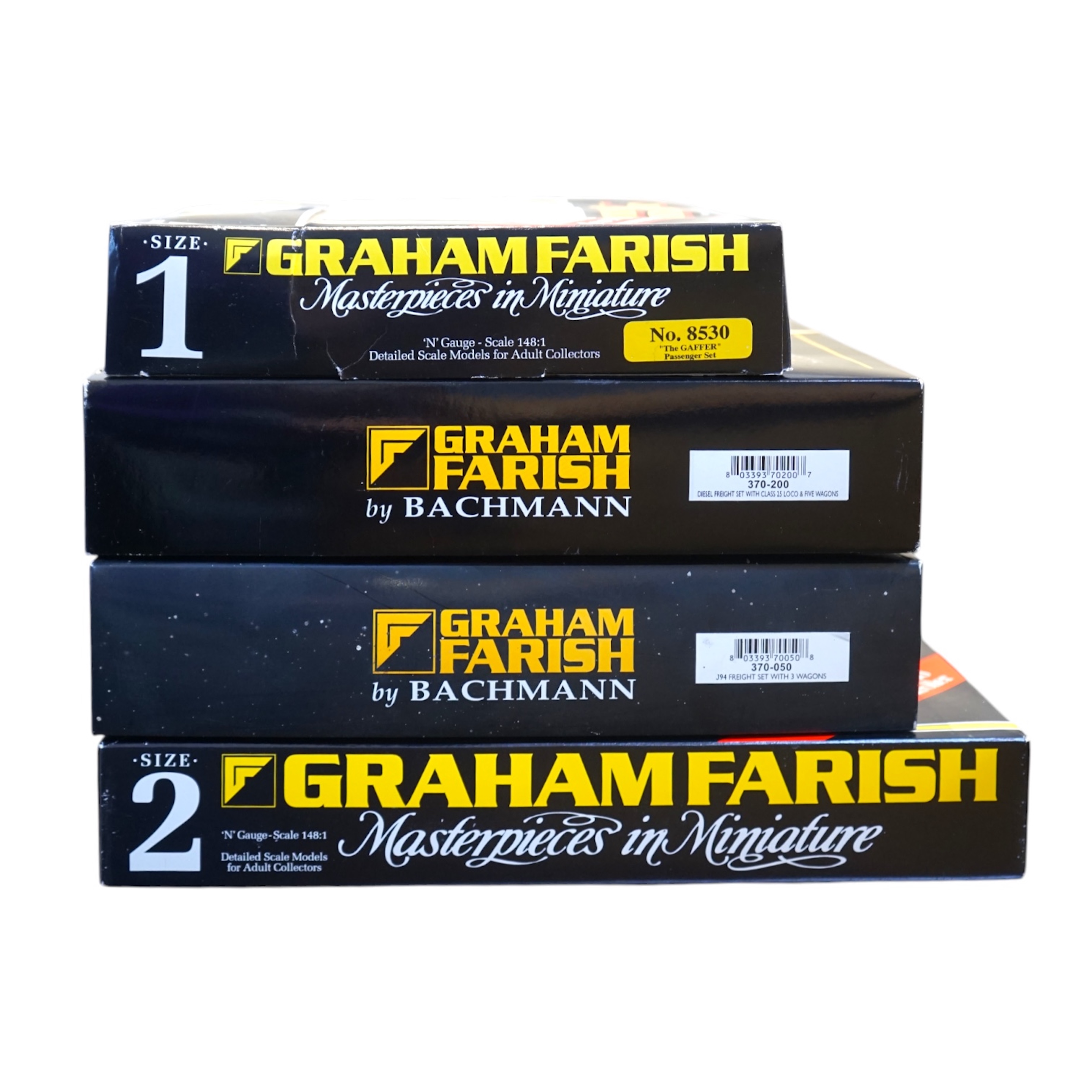 Four boxed Graham Farish N gauge railway train sets; a Diesel Freight set, comprising a Class 25 diesel locomotive and five freight wagons, together with a J94 Freight set with three wagons (370-050), a Queen Elizabeth G